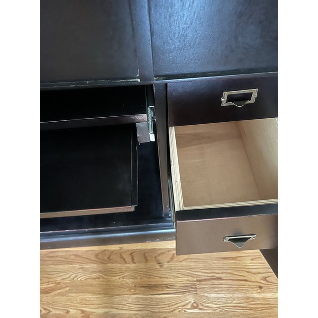Computer armoire with wrap doors, pull out keyboard drawer and lots of compartmentilized storage. Back is tacked on and...