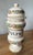 Accent your home with this gorgeous Italian faience vessel. Hand-painted botanical motifs encircle the body and lid of...