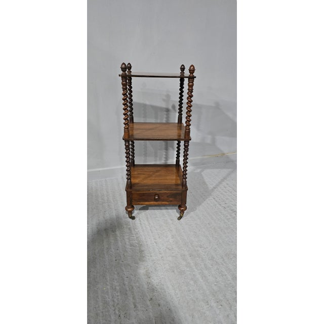 A top quality three tier William 4th rosewood ettagere, with crisp twisted supports and single drawer, original turned...
