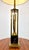 A very tall and elegant table lamp with modernist cattails sculptures encased in a brass and glass vitrine. Original...