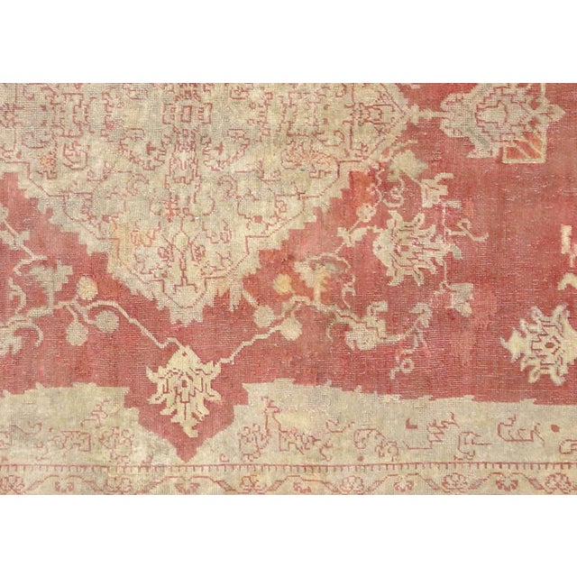 Expertly hand-woven in the Oushak region of Western Turkey, this Vintage Turkish Oushak Rug showcases the rich tradition...