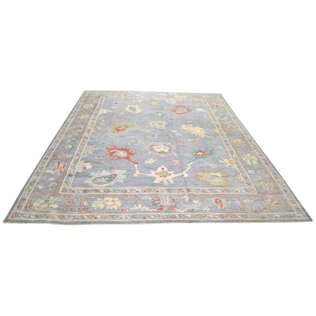 Hand-knotted with care using traditional rug making techniques, this wool rug blends timeless craftsmanship with a modern...