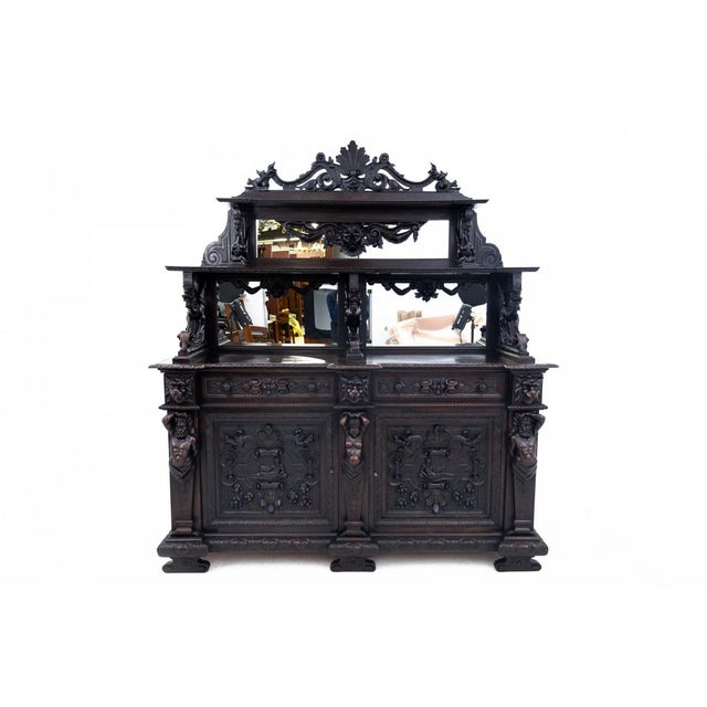 An antique renaissance-style sideboard (credenza with a hutch). Crafted in the early 19th century. A unique piece, richly...