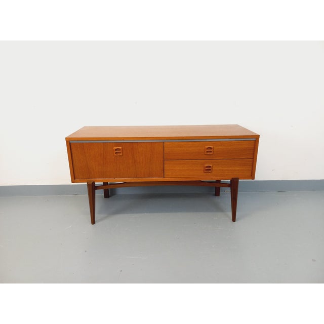 Small vintage Scandinavian-style sideboard from the 1960s, made of teak, with a beautiful, airy, splayed base, two...