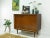 The sideboard is an original from the 1960s. The furniture was originally designed as a combined cabinet for radio and...