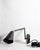 Pair of authentic wall sconces by Cedar & Moss in matte black finish with brass accents. Excellent condition, like new....