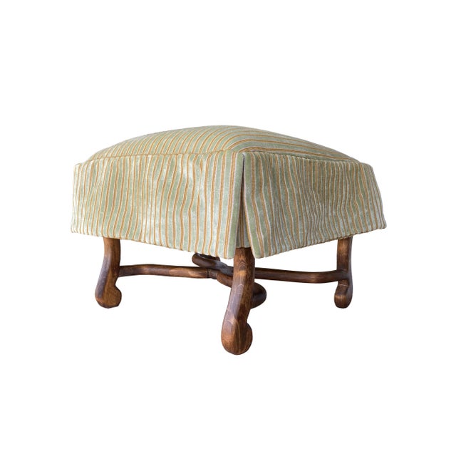 A tailored Spanish-style Kreiss ottoman. Re-upholstered exclusively for THE TASTEMAKER SHOPPE, in a lush Rose Tarlow...