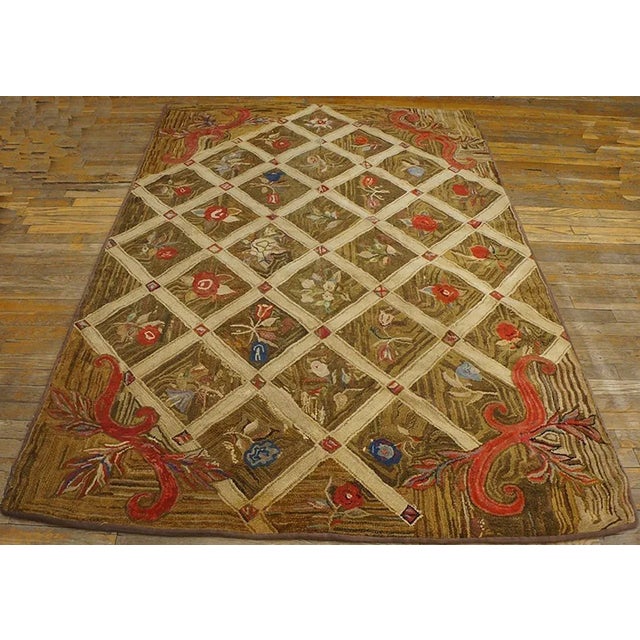 Antique American hooked rug, size: 5'0" x 7'3".