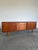 Long Danish Teak credenza or sideboard by Clausen & Son Denmark c.1960’s. Large sliding door at either end open to ample...