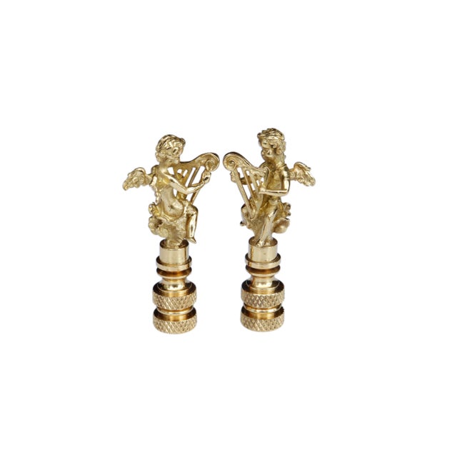 A pair of angel with harp lamp finials. Fits a standard size lamp harp. Dimensions per finial. We have more lamp finials...