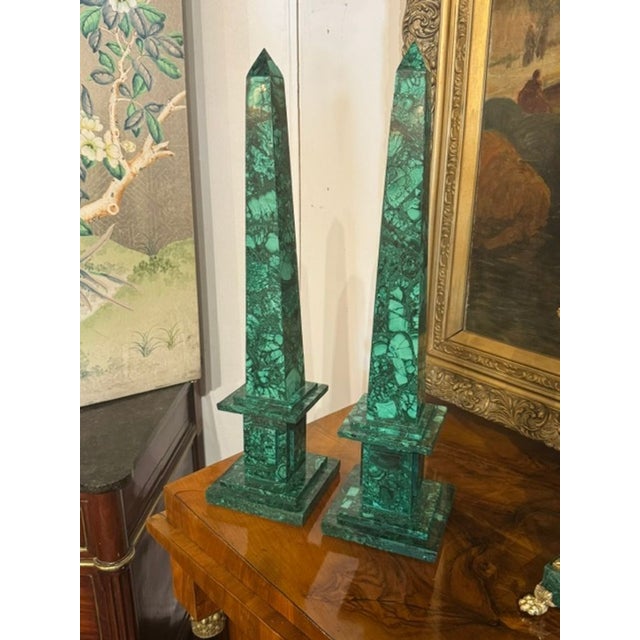 The product is a pair of French malachite obelisks, which are lovely collectibles that add a touch of elegance and...