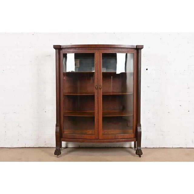 R. J. Horner Style Antique American Empire Oak Bow Front Bookcase Cabinet With Lion's Paw Feet, Circa 1890 For Sale - Image 12 of 12