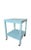 A wooden painted side table that is a pretty aqua color and it has wheels. It is a vintage piece from the 1950's.