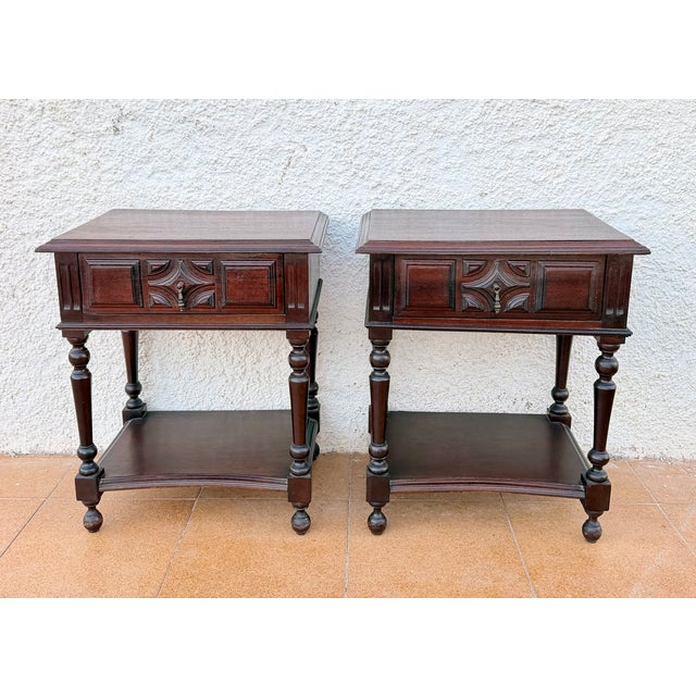 Charming pair of Spanish bedside tables dating from the mid-20th century. Crafted in wood, each table features a spacious...