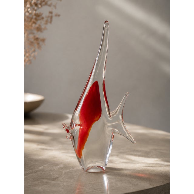 Elegant Sommerso glass fish sculpture hand-crafted in Murano by the historic furnace Formia. The piece features a vibrant...
