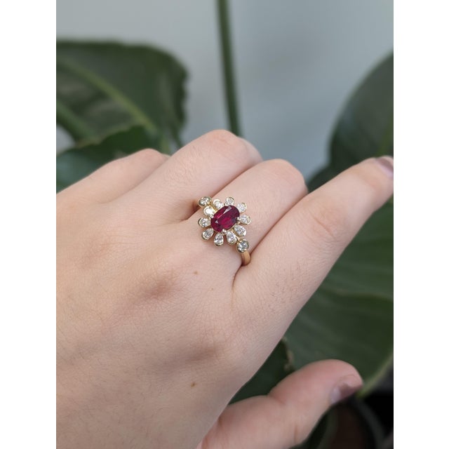 Say hello to your new favorite showstopper! This floral ring rocks a juicy 1-carat Mozambique ruby (7x5mm) front and...