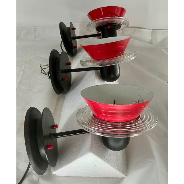 Set of three fabulous Memphis design style wall sconses by renowned Italian lighting brand Lamperti. Black finish round...