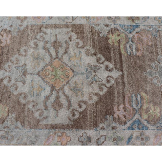 Long Turkish Oushak Runner With Pale Blue, Soft Yellow, and Light Brown Motifs For Sale - Image 11 of 13