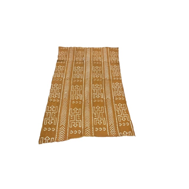 Superb mud-cloth cotton fabric with a geometric design. Handwoven, hand-sewn, and hand-dyed by the men and women of the...