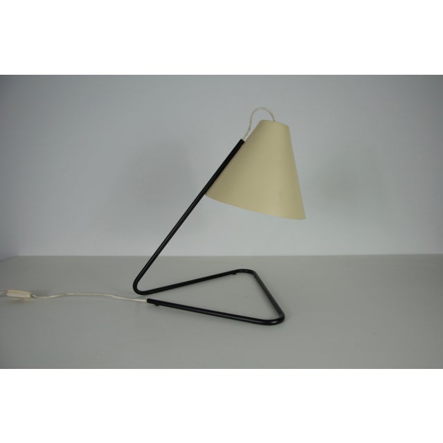 This elegant table lamp from the 1960s is a stunning example of Italian mid-century modern design. Crafted from metal, it...