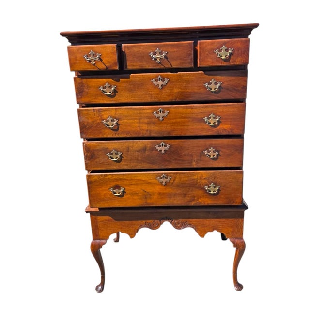 A handsome Queen Anne style highboy chest crafted from solid walnut, featuring beautifully figured grain, traditional...