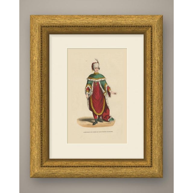 An original antique wood engraving, colored by hand with watercolor, showing a commander of the order of saint stephen of...