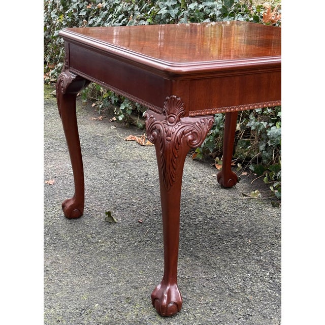 Lovely Chippendale carved end table lat with striking flame mahogany top.The table stands on beautifully carved cabriole...