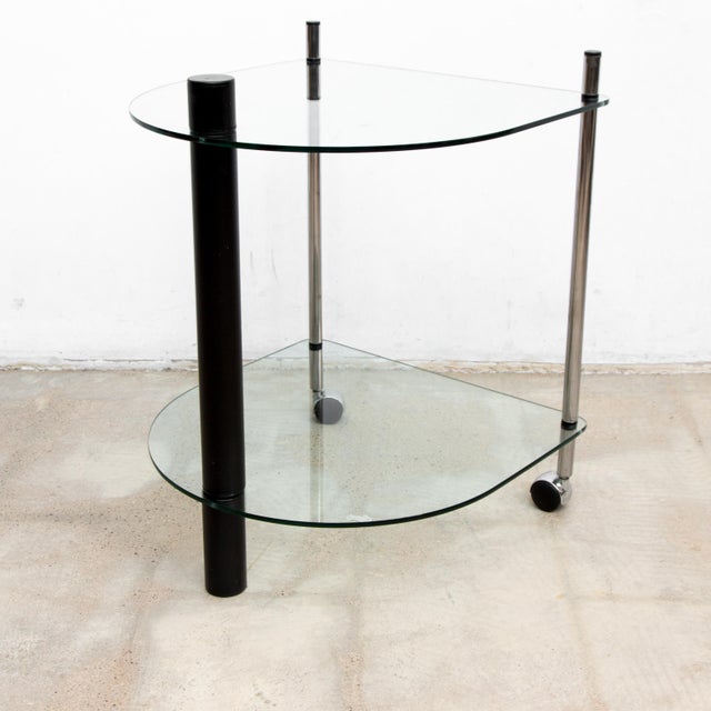 This 1980’s styled cocktail cart , is designed in the archetype materials and geometric shapes of the 1980’s. Hardened...