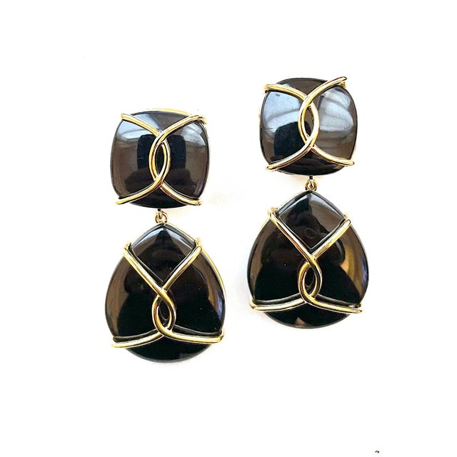 Large 18kt Twisted Yellow Gold and Onyx Drop Earring. This elegant earring measures ~2"inches long. The top cushion shaped...