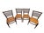 A beautiful set of four vintage Italian dining chairs dating to the 1960s, featuring elegant ladder-back silhouettes and...