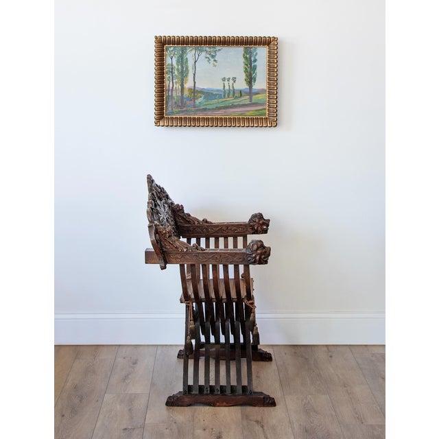 A striking late 19th-century Italian Renaissance Revival Savonarola chair, circa 1870–1900, crafted in richly patinated...