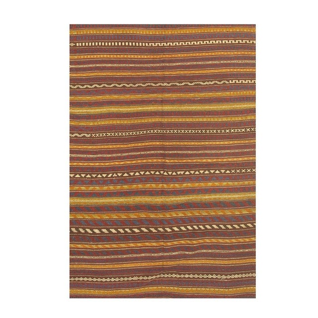 This is a vibrant and highly authentic vintage mid-century Turkish Kilim, Measuring an adaptable 4'3" x 5'8", this wool...