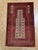 Hand-knotted Baluch rug, traditionally woven by tribal groups of eastern Iran and Afghanistan. Features an ivory central...