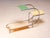 An elegant vintage flower stand designed by Emile Guyot, featuring a graceful chrome-plated tubular steel frame fitted...