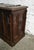 A 19th-century carved oak chest in the Neo-Gothic style. The front is punctuated by vertical carved panels decorated with...