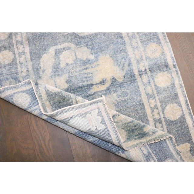 A small chinese pictorial rug with 2 reindeers on a blue field