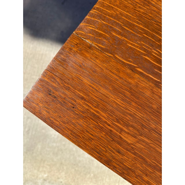 An elegant antique dining room server crafted from beautifully figured quarter-sawn tiger oak, featuring distinctive grain...