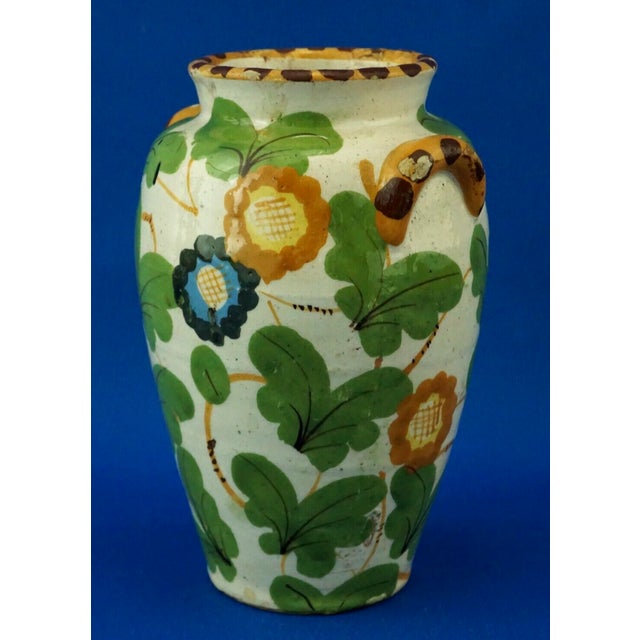 Apothecary jar, a ceramic albarello with floral decorations, hand-shaped on a wheel, enameled and entirely hand-decorated,...