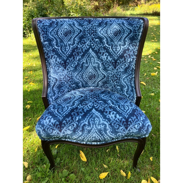 A pair of vintage accent chairs NEWLY upholstered in a gorgeous indigo damask, velvet fabric that gives an opulent,...