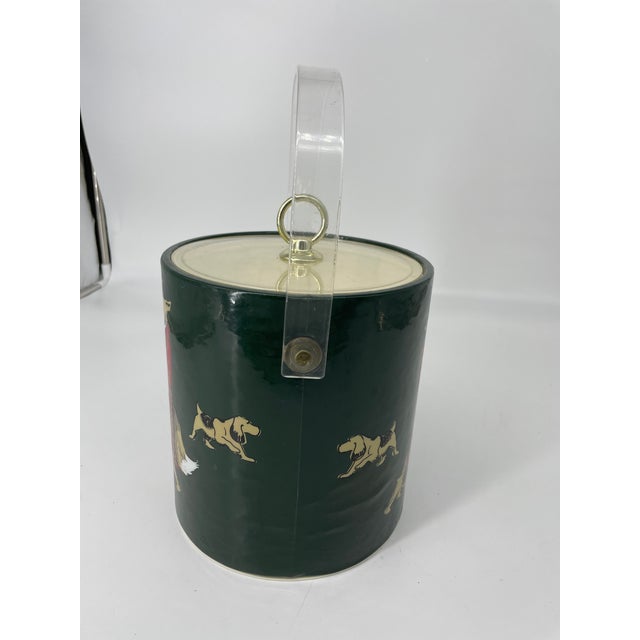 This whimsical ice bucket would add character to any hunting motif. The "hunter" is a lady fox who is leading her hounds...