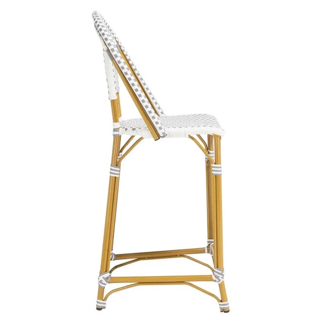 The beloved European bistro chair assumes a coastal update in this grey and white bar stool. The cheerfully woven PE...