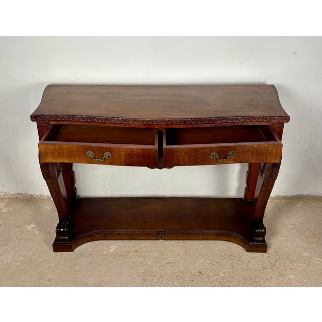 This elegant Spanish console table of wood showcases the rich character of traditional Spanish craftsmanship. Featuring...