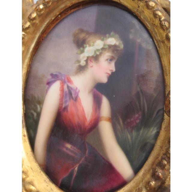 Gilt wood frame with porcelain portrait. A fine Pre-Raphaelite maiden in a sheer dress with a garland of roses around the...