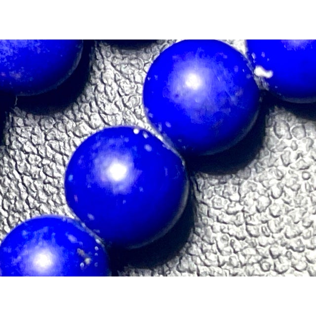 Lapis lazuli with very vibrant clean beads. Combined with pearls and gold accents, this style of beaded necklace was...