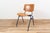 Industrial chairs by Kho Liang Ie for CAR Katwijk. The chair comes with a wooden seating and backpiece on a blue coated...
