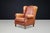 Impressive cognac leather wingback lounge chair, originating from The Netherlands and dating from the 1960s, upholstered...