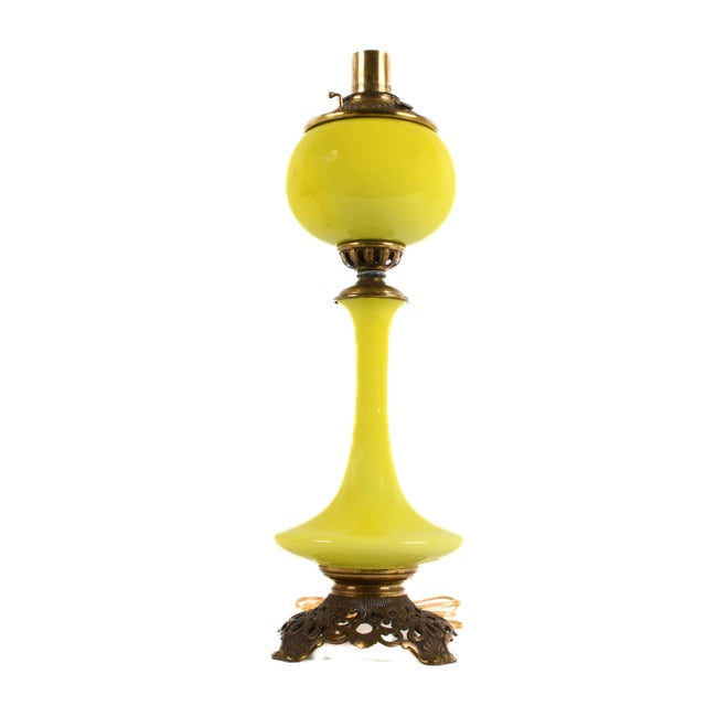 This striking antique chartreuse cased glass genie oil lamp features a bold, sculptural silhouette and vibrant color that...