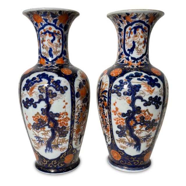 A gorgeous pair of Meji period Japanese export Imari vases in beautiful cobalt and pumpkin glaze.