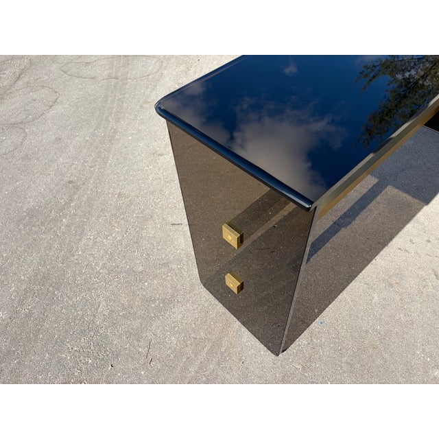 High Quality Mid Century Modern Dark Glass Console Table with Brass Stretchers. No Chips. Ready for a new home.