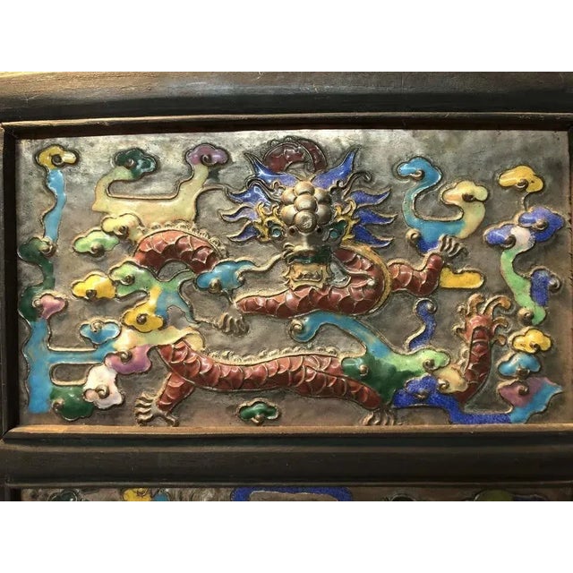 A very unique piece with a stunning double dragon design. The dragon metal plaque appears to be older than the frame. I...
